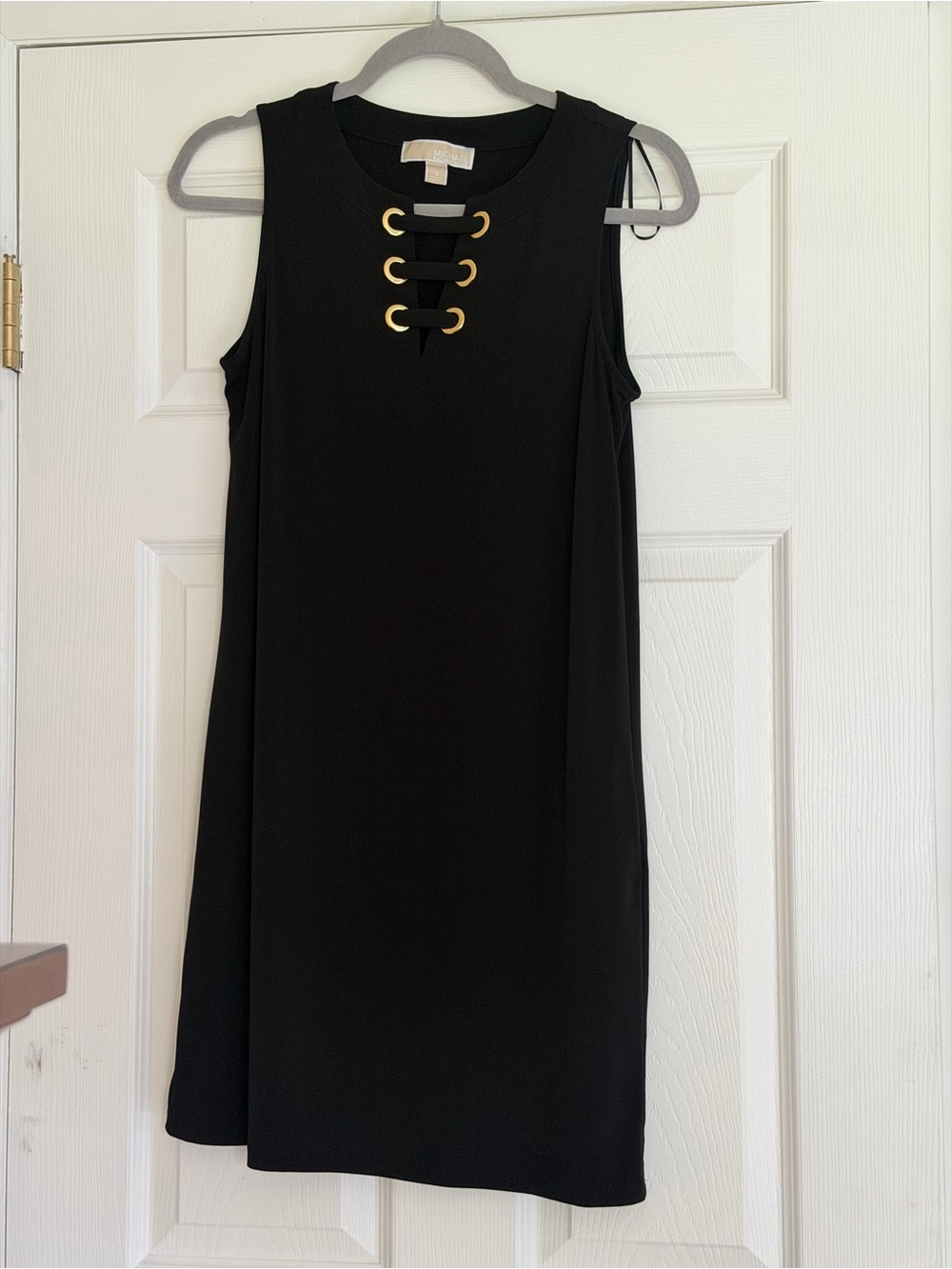 Sleeveless Black Shift Dress with Gold Eyelet Detail